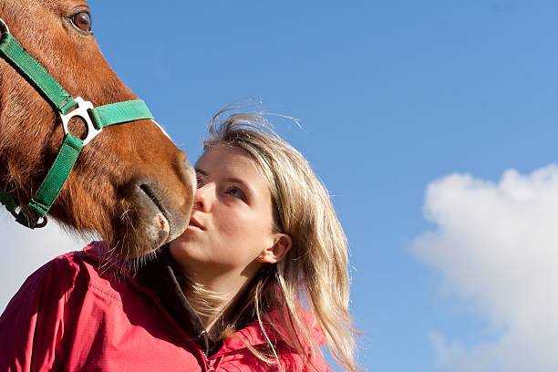 istock Look into my eyes-girl gazes lovingly at her pony 152253967