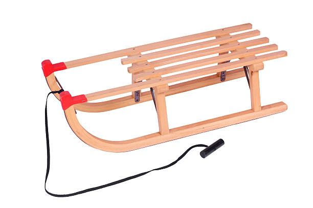 istock Wooden sled, isolated against background 152254279