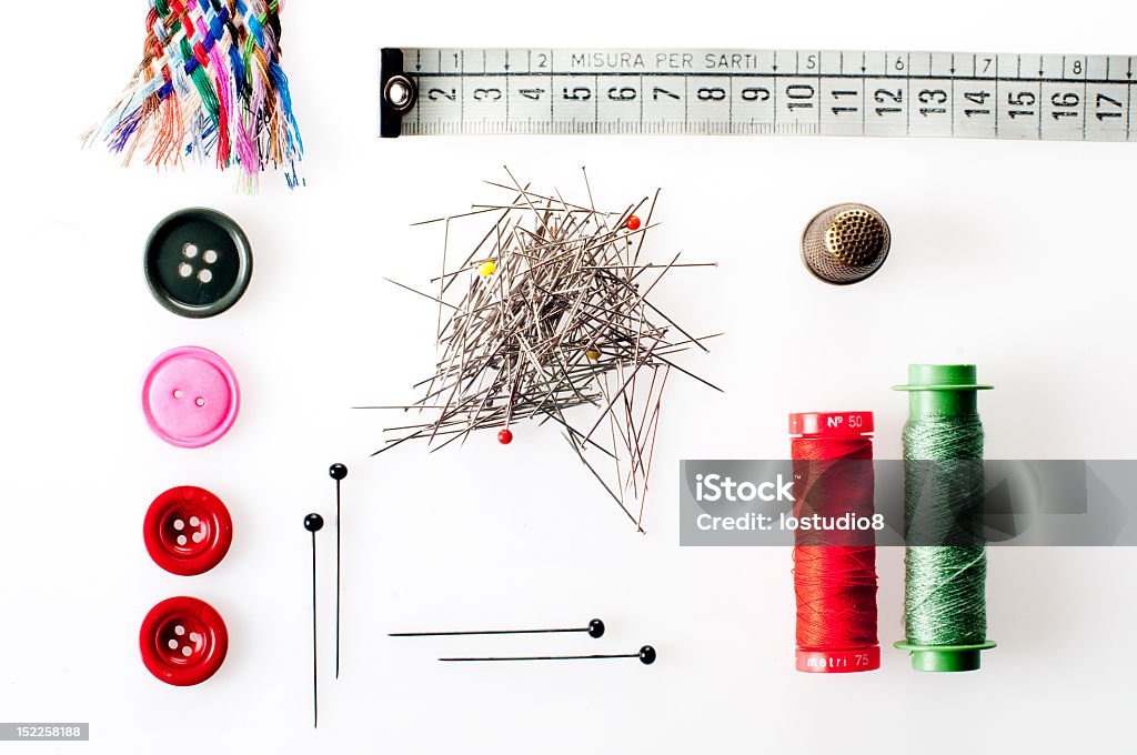 The Dressmaker Buttons, thread and pins, thimble, measuring tape. Brooch Stock Photo