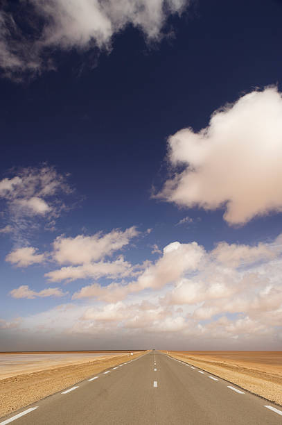 istock Road in the Sahara Desert under Clouds 152259223