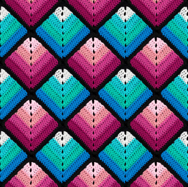 istock Seamless knitted pattern in the form of gradient rhombuses is crocheted with multi-colored threads. Patchwork style. 1522621505