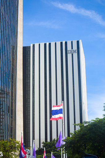 IBM  office building skyline in Bangkok seated at 388 Phahonyothin Road, Samsen Nai, Phaya Thai. At bottom is a thai flag