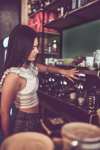 istock Gorgeous Female Barista Making Latte Macchiato 1522708114