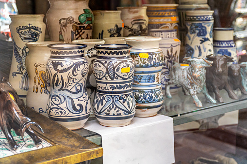 Traditional ceramics from Teruel. Old bottles for pharmacies. In a store window.