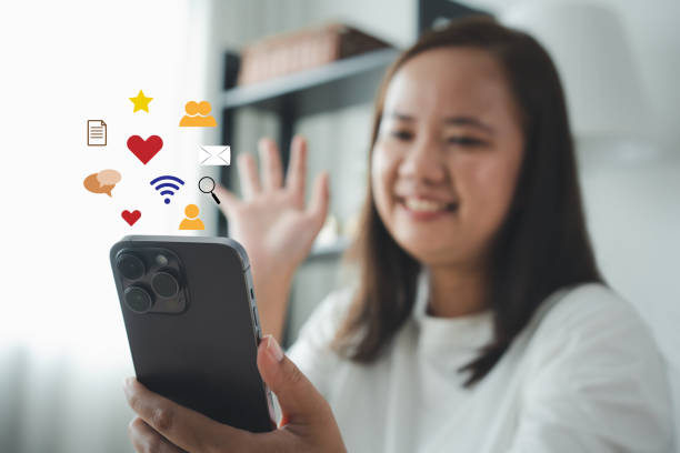 istock Asian woman using mobile phone for social media access with other users via online network with icon 1522790140