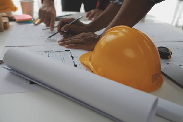 istock Construction and structure concept of Engineer or architect meeting for project working with partner and engineering tools on model building and blueprint in working site, contract for both companies. 1522803656
