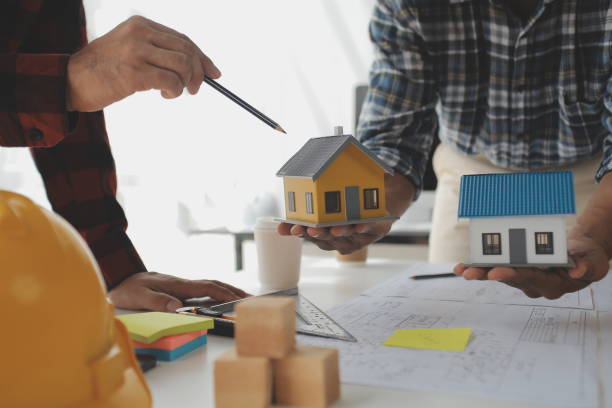 istock Construction and structure concept of Engineer or architect meeting for project working with partner and engineering tools on model building and blueprint in working site, contract for both companies. 1522804171