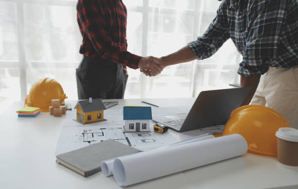 istock Construction and structure concept of Engineer or architect meeting for project working with partner and engineering tools on model building and blueprint in working site, contract for both companies. 1522806738