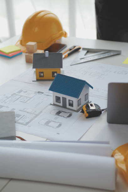 istock Construction and structure concept of Engineer or architect meeting for project working with partner and engineering tools on model building and blueprint in working site, contract for both companies. 1522807431
