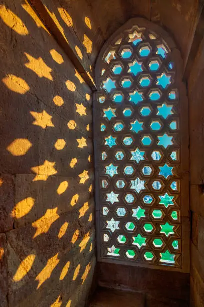 Qutb Minar, Delhi, carvings in the sandstone of a window gives a pattern of sky with stars