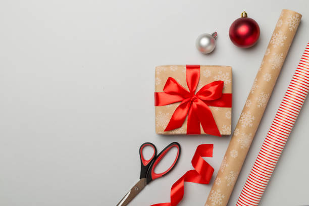 istock Gift boxes, paper's rools and decorations on color background, top view 1522949749
