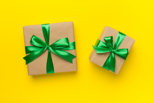 Gift boxes on color background, top view.