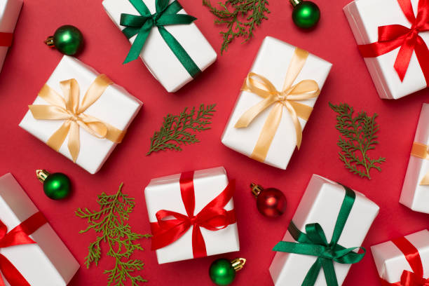 istock Gift boxes with decor on color background, top view 1522949785