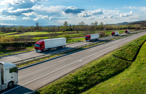 istock Convoy of cargo transportation trucks 1522957385