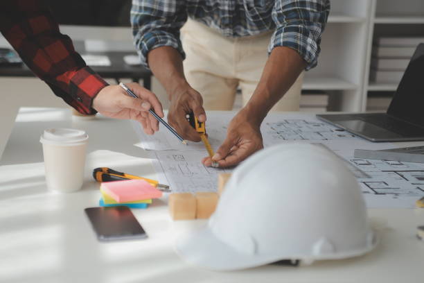 istock Construction and structure concept of Engineer or architect meeting for project working with partner and engineering tools on model building and blueprint in working site, contract for both companies. 1522963296