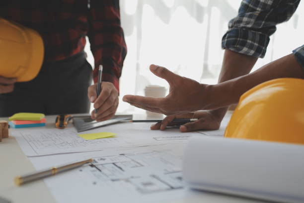 istock Construction and structure concept of Engineer or architect meeting for project working with partner and engineering tools on model building and blueprint in working site, contract for both companies. 1522963841