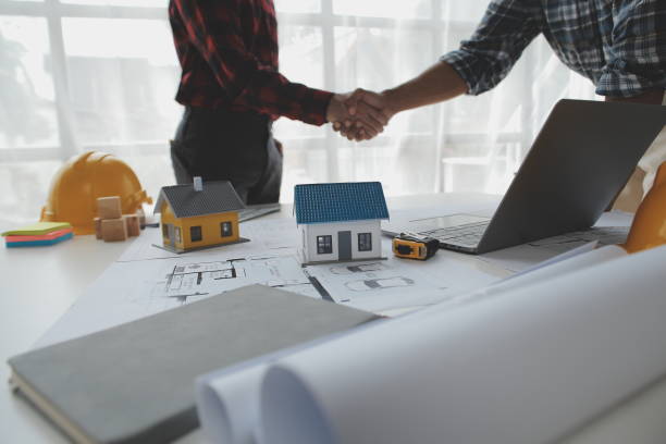 istock Happy workers at construction site, young civil engineer manager and architects handshaking at construction site and looking to next construction phase , cooperation teamwork concept. 1522968511