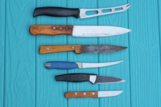 istock a set of a row of different old colored table knives 1523032852