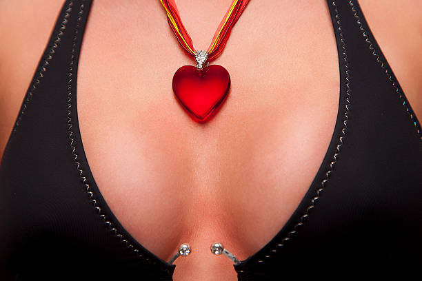 istock Red heart shape necklace on woman's breast 152308943