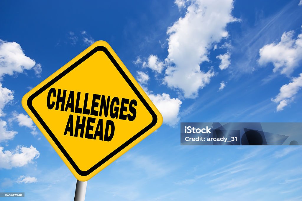 Diamond shapes yellow sign against the blue sky Challenges ahead sign over blue sky Achievement Stock Photo