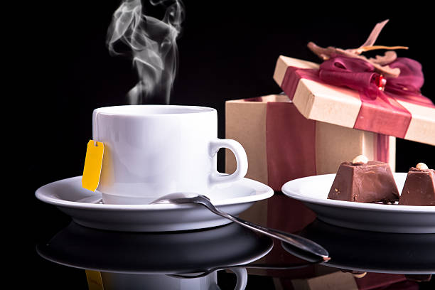 Tea, chocolate and gift stock photo