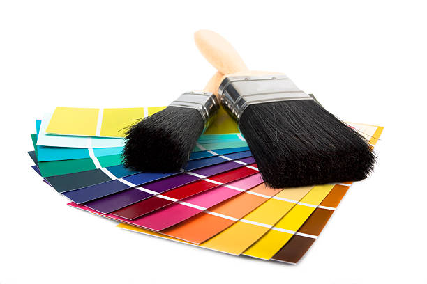 paint brush and multi coloured swatches stock photo