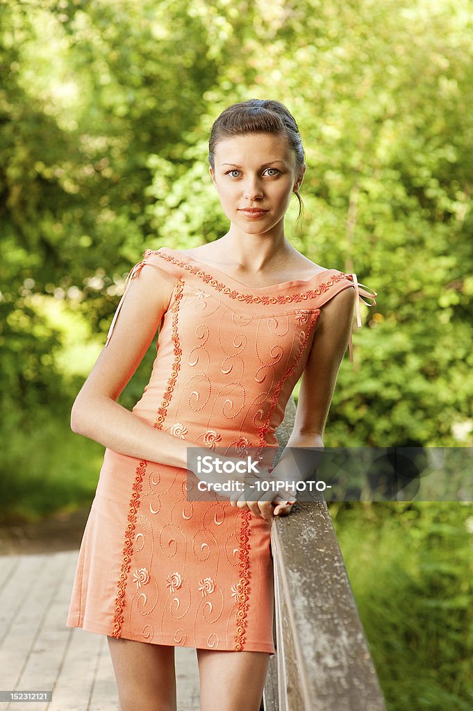 Girl on bridge Girl on bridge, summer outdoor shot. Adult Stock Photo