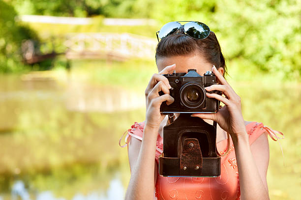 istock Young girl with camera 152312126