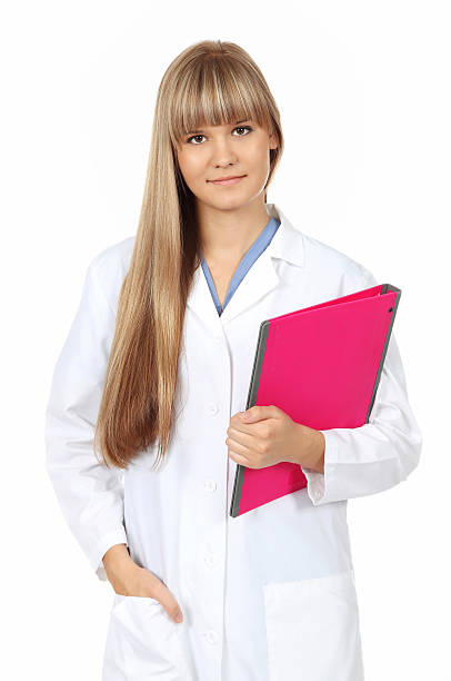 Young female doctor holds a pink folder stock photo