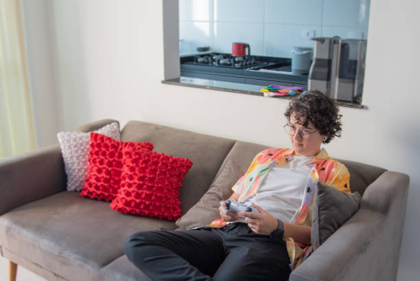 istock woman sitting down playing video games 1523138436