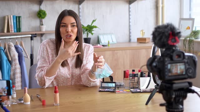 Young Woman Doing A Makeup Vlog At Her Apartment