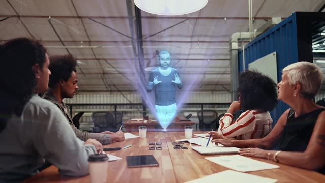 Coworkers using augmented reality device to see a video call hologram at office