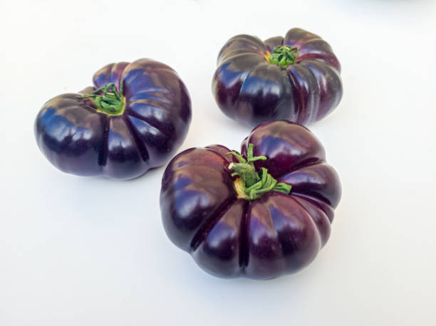 istock Blue beef tomato on a white background. Fresh purple tomato, isolated on white background, with clipping path 1523289800