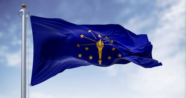 Indiana state flag waving in the wind on a clear day Indiana state flag waving in the wind on a clear day. Indiana is a U.S. state in the Midwestern United States. 3d illustration render. Fluttering fabric seal of the state of indiana stock pictures, royalty-free photos & images