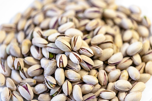 Closeup roasted and salted Pistachios, full frame horizontal composition