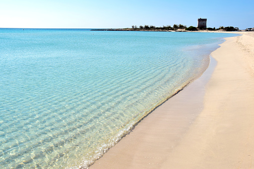 view of crystaline and turqoiese water in a beach in Porto Cesareo a small fishing town in Salento in the Puglia region  in the south of Italy