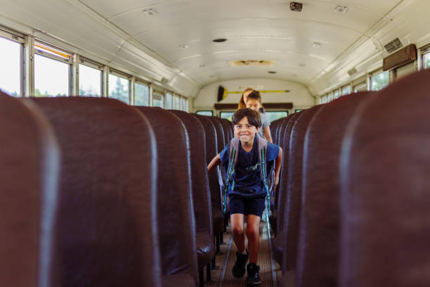 istock Happy Hispanic boy getting off school bus 1523376972