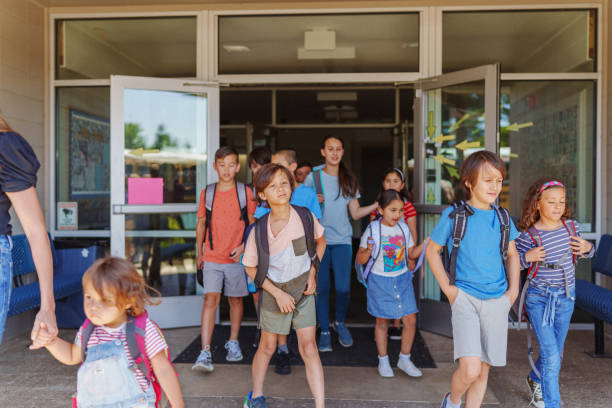 istock Students leaving school at the end of the day 1523376989