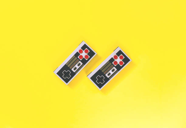 overhead of Retro NES Controller equipment in vogue in the 80s / 80s passions on yellow background
