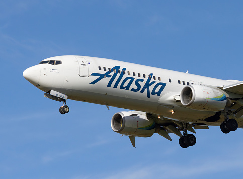 Portland, Oregon, USA - May 28, 2023: An Alaska Airlines Boeing 737 comes in for a landing at Portland International Airport.