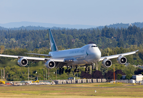 Portland, Oregon, USA - June 10, 2023: A Cathay Pacific Boeing 747 coming in for landing at Portland International Airport.