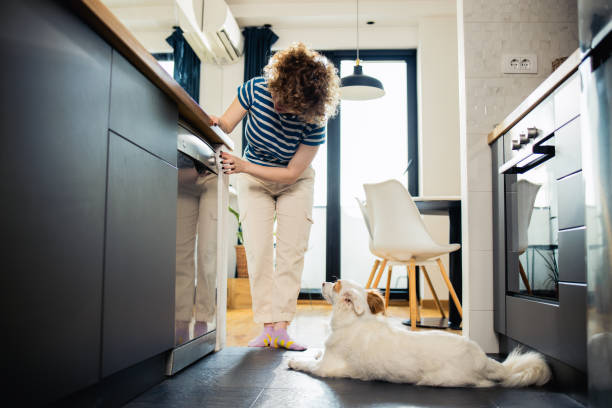 istock Young, happy woman manages household processes through an application 1523598229