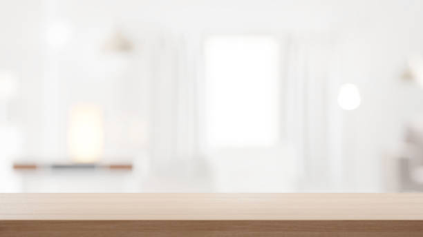 istock Empty wooden countertop with blurry modern cozy background with window and home interior, background for products, presentations and design 1523623407