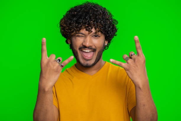 istock Indian man showing rock n roll gesture by hands, cool sign, crazy expression, dancing, celebrating 1523649170