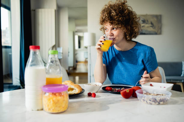 istock Young woman has breakfast 1523679842