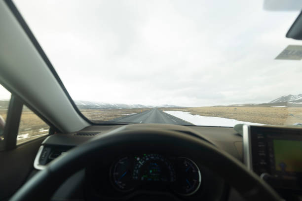 istock View through the windshield from the car on the road with copy space. Iceland 1523691449
