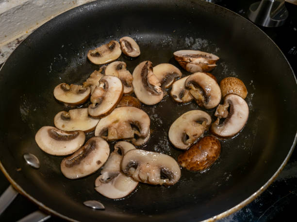 istock sliced mushrooms cooking in a frying pan 1523878658