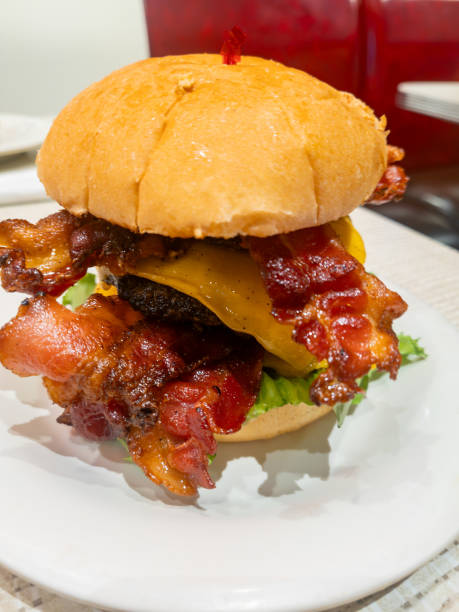 istock Bacon double cheeseburger with lettuce on a plate 1523879185