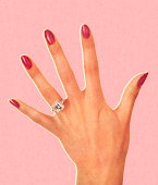 istock Woman's Hand Wearing Engagement Ring 152405742