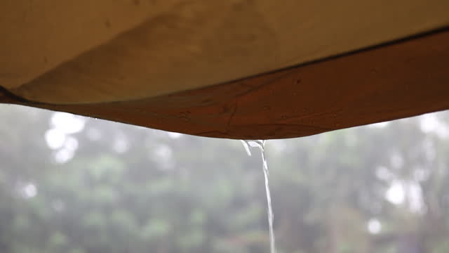 Rain falling on tent camping in long weekend at Thailand.